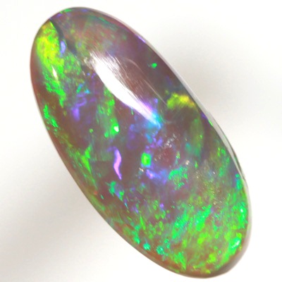 SOLID BLACK CRYSTAL OPAL Rolling flashes of green over purple fire